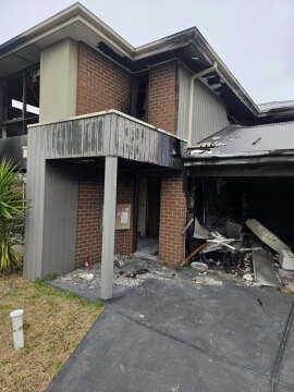 Garage Fire Damage Where Early Sprinkler Activation Could Have Limited Spread