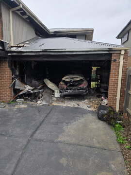Garage Fire Damage Where Early Sprinkler Activation Could Have Limited Spread