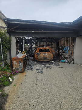 Garage Fire Damage Where Early Sprinkler Activation Could Have Limited Spread