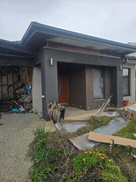 Garage Fire Damage Where Early Sprinkler Activation Could Have Limited Spread
